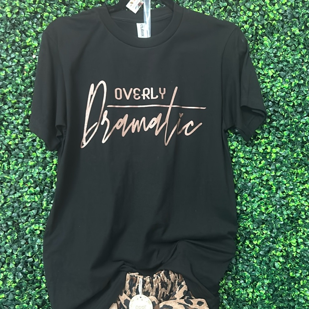 Black tee with gold print. Over dramatic